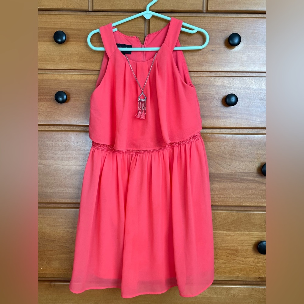 In girl / Dillards dress- size 6x. Bright coral and flows.